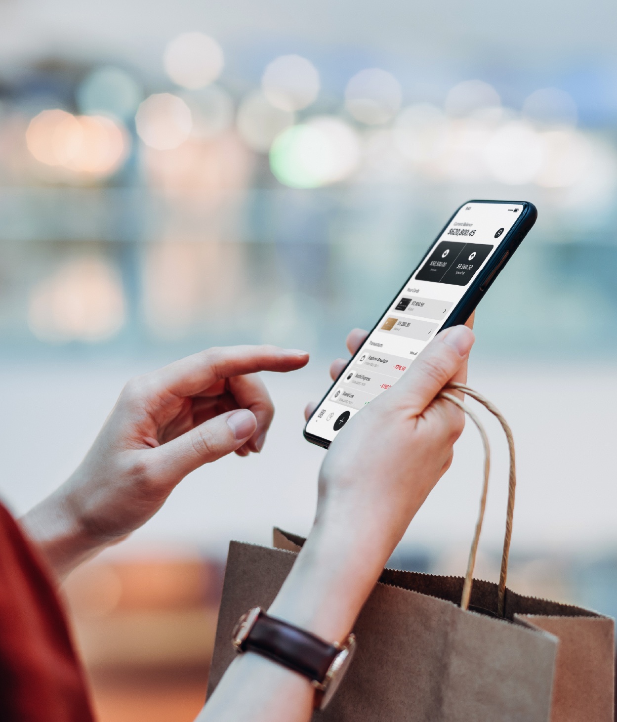 Woman using a banking app on her mobile phone.
