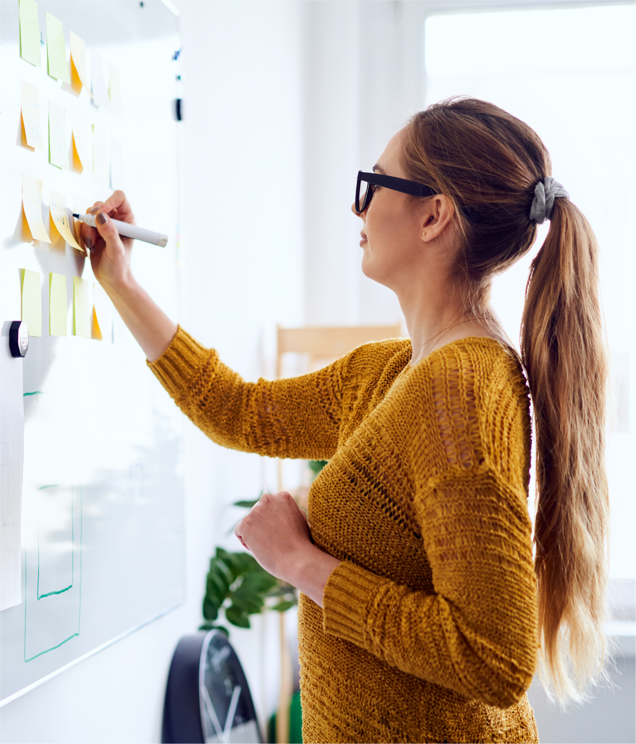 Businesswoman writing on whiteboard