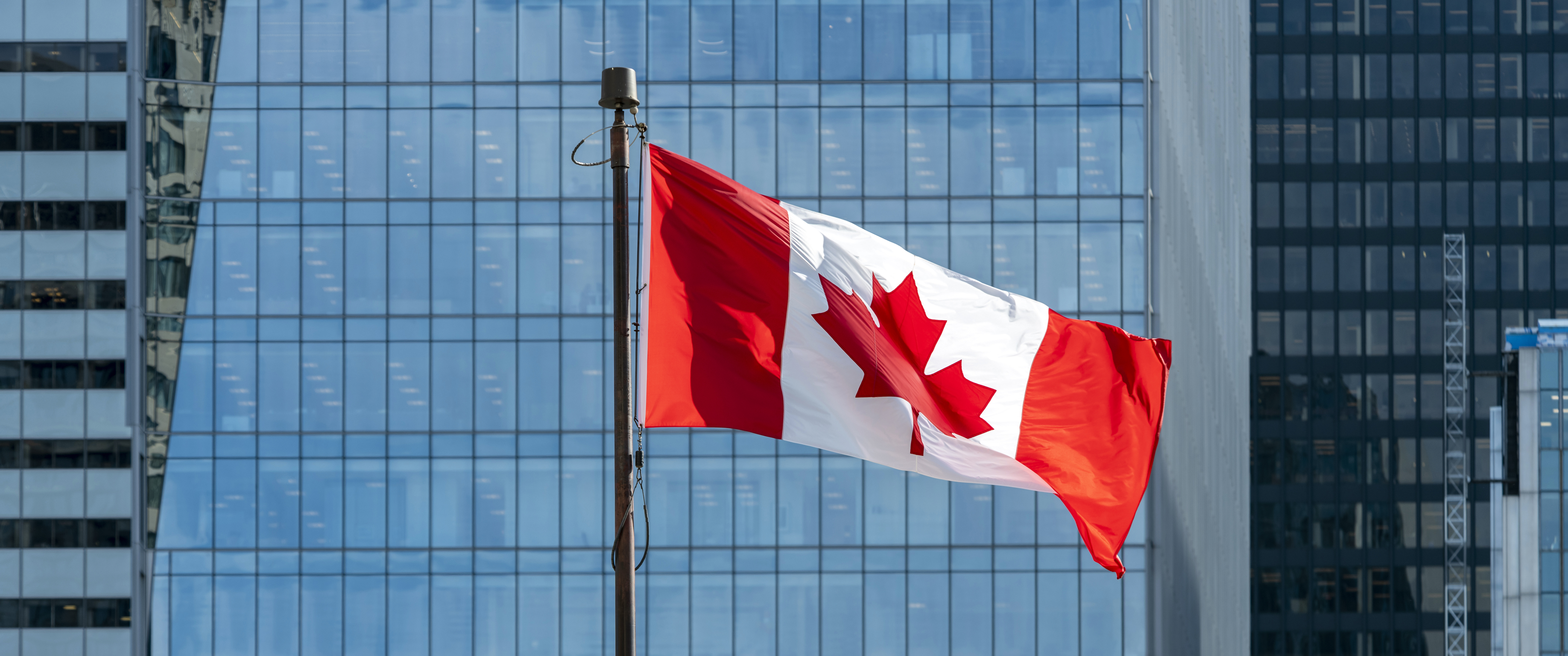 Canadian flag waving on the wind